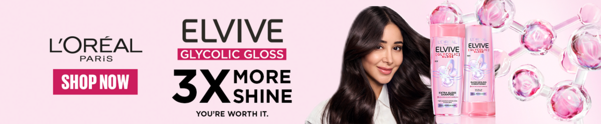 L'Oréal Paris Elvive Glycolic Gloss ad banner featuring a woman with long dark hair, two pink bottles of the product, and promotional text including '3X More Shine' and 'Shop Now' on a light pink background.